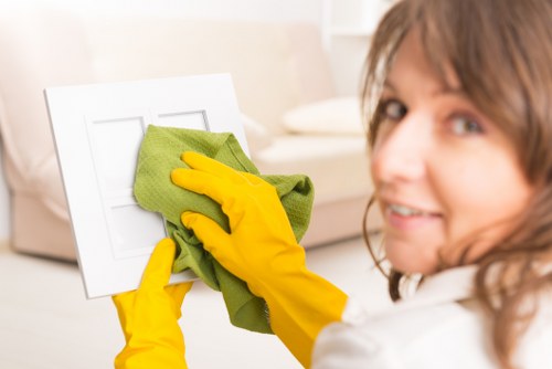 Cleaner working on residential and commercial windows in W5